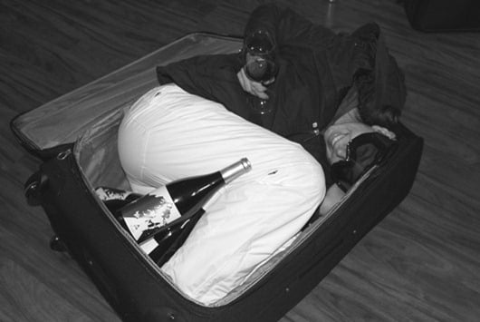 Flying with wine? Make sure the wine fits in your bag, then pack your wife!